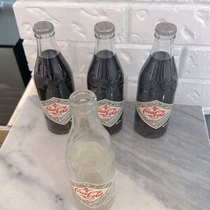 CocaCola 75th Anniversary bottles-3unopened, 1empty, intact collectible bottle